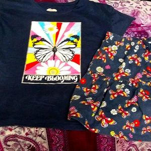 A cute T-shirt with a skirt with shorts underneath of it.